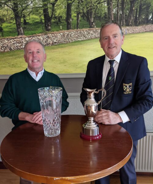 Captain Bernard presenting Sean Treanor with his prize for Golfer of the Year.